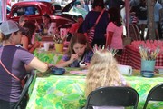 family eating at table outdoors